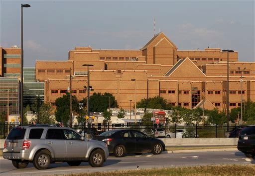 Vehicles drive toward the entrance of Brooke Army Medical Center Friday, in San Antonio. Bowe Bergdahl, the Army sergeant who has been recovering in Germany after five years as a Taliban captive, returned to the United States early Friday to continue his medical treatment at the facility.