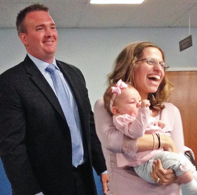 Corey Donnelly introduced his wife and baby daughter to the council after being appointed patrolman.