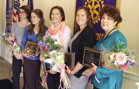 Greer Fleisher, Lisa Arakelian and Nancy London were honored for their service above self within the community by being presented with Unsung Hero awards Thursday afternoon at a Portsmouth Rotary Club luncheon. The fourth recipient, Meghan Lennon, could not attend but is represented here by two fellow staff members (left).