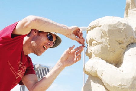 Sand sculptor David Andrews of Wisconsin works his art at last year’s Hampton Beach Master Sand Sculpting Competition.