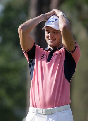 Martin Kaymer, of Germany, reacts after missing a putt on the 10th hole during the third round of the U.S. Open golf tournament in Pinehurst, N.C., Saturday, June 14, 2014. (AP Photo/Eric Gay)