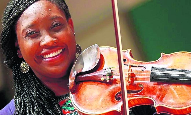 Violinist Chelsea Sharpe, whose nickname is "C Sharp," has earned teachers' 
admiration for mastering the emotion and character of the pieces she plays.
STAFF PHOTO / 
THOMAS BENDER