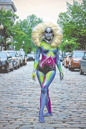 Heather Berthelette, 24, of New Bedford stepped out of the TL6 Gallery window to pose on William Street on AHA! Night. She was one of four models bodypainted by local artist Melinda Abreu for her exhibit "Living Couture: The Body as Canvas," taken from the gallery to the street for the first time Thursday.