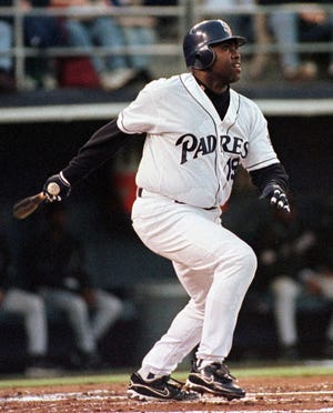 FILE - In this April 24, 1999 file photo, San Diego Padres' Tony Gwynn watches his first inning home run against the Arizona Diamondbacks, in San Diego. The Baseball Hall of Fame said Gwynn died of cancer on Monday, June 16, 2014. He was 54. (AP Photo/Denis Poroy, File)