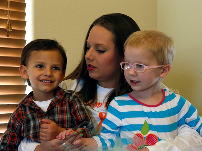 A mother of a child with cancer Sierra Riddle plays with her son Landon, age 4, left, and Landon's friend Dahlia, age 3, who also has cancer, during a play date on April 29 at Dahlia's home in Colorado Springs. Landon and Dahlia's parents, frustrated with mainstream medical treatments and facing the possibility of intervention by child protective authorities, moved to Colorado to treat their children using what some describe as cutting edge cannabis medication.