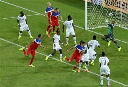John Brooks, second from left, scores the winner for the United States.