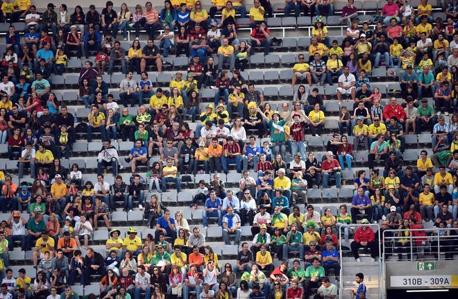 Empty seats scattered in the stands of the stadium during the group F World Cup soccer match between Iran and Nigeria at the Arena da Baixada in Curitiba, Brazil, Monday.