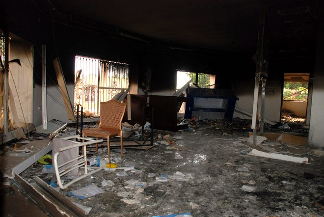 Glass, debris and overturned furniture are strewn inside a room in the gutted U.S. consulate in Benghazi, Libya, after an attack that killed four Americans, including Ambassador Chris Stevens, Wednesday, Sept. 12, 2012. (AP Photo/Ibrahim Alaguri)