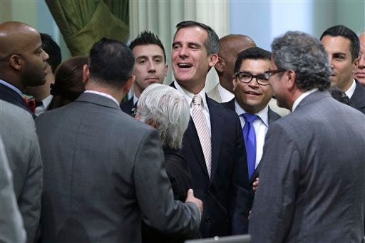 Los Angeles Mayor Eric Garcetti, center, seen with legislators, used the F-bomb during a celebration of the Kings winning the Stanley Cup.