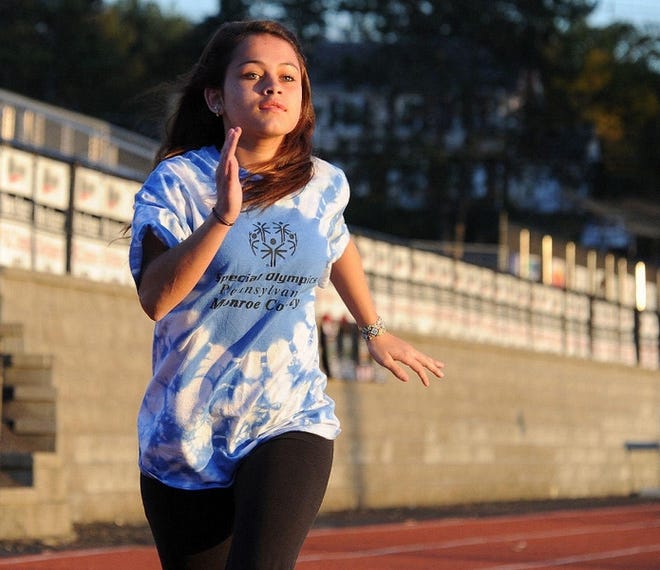 Sharlene Valentin, 16, of East Stroudsburg, trains on the track for her events in the Special Olympics.
