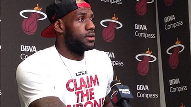 LeBron James speaks to the media at the Heat postseason news conference on Tuesday, June 17, 2014, in Miami. (Photo by Jason Lieser)