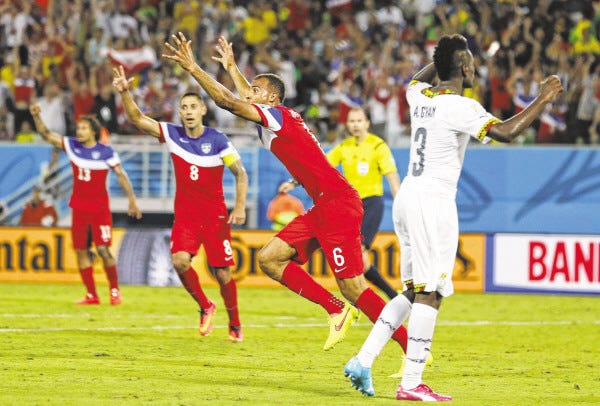 The United States' John Brooks celebrates with teammates after scoring his side's second goal during the Americans' group G victory over Ghana on Monday at the Arena das Dunas in Natal, Brazil.