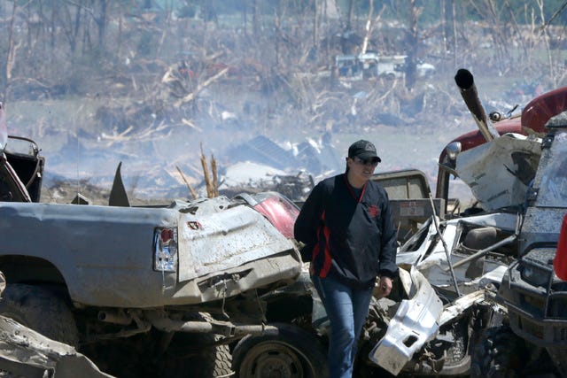 ASSOCIATED PRESS FILE PHOTO / A woman walks through storm rubble May 1 near a Vilonia neighborhood that was struck by a tornado on April 27. Forecasters say a tornado that hit Little Rock's suburbs and killed 15 people had winds approaching 200 mph. The storm was rated as a "high-end" EF-4 on a scale of tornado strength. 
 ASSOCIATED PRESS FILE PHOTO / President Barack Obama tours tornado-damaged areas of Vilonia on May 7 and talks with Daniel Smith and his sons, Garrison and Gabriel Dority.