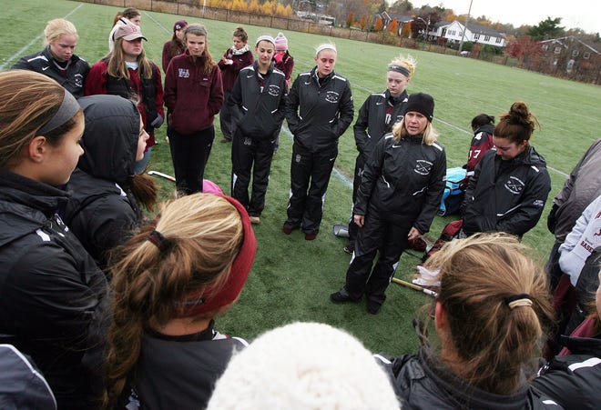 Westford Academy field hockey Coach Raeann Gembis talks with her team after they lost 3-2 to Acton Boxborough in the Division 1 North Finals in the fall of 2013. Gembis, who is retiring, led the team to the finals for the first time in team history. Wicked Local Staff Photo/Ann Ringwood