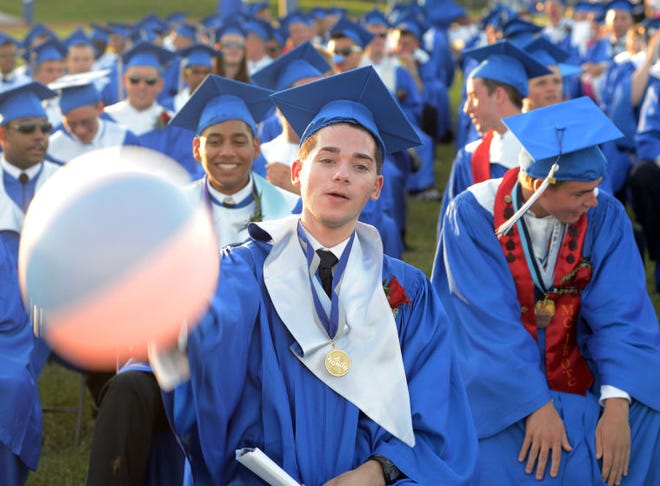 BENSALEM, PA - JUNE 18: Joshua A Shapey hits a beach ball during Bensalem High School's 90th Annual Commencement ceremony June 18, 2014 at Bensalem Memorial Stadium in Bensalem, Pennsylvania. About 500 students graduated. (Photo by William Thomas Cain/Cain Images)