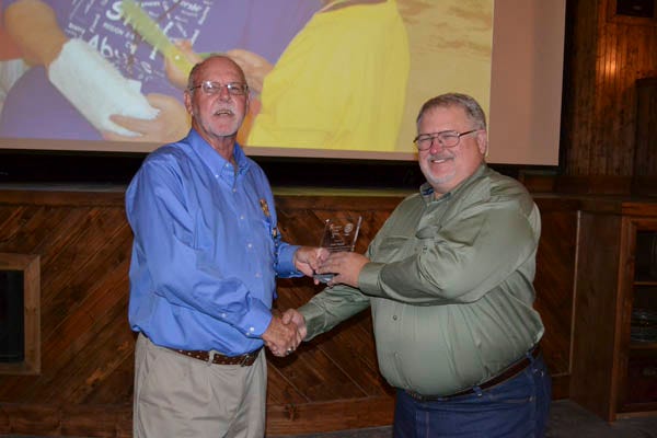Karl Vancil (r) receives the Rotarian of the Year award, presented by David Cowart.