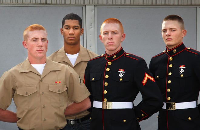 From left, Marines Paul Souza of Braintree, Joseph Pinto of Weymouth, Jamey Kerr of Abington and Ryan Kliphan in Weymouth at the Marine Corps Recruiting Station, in Quincy on Thursday, Nov. 3, 2011.