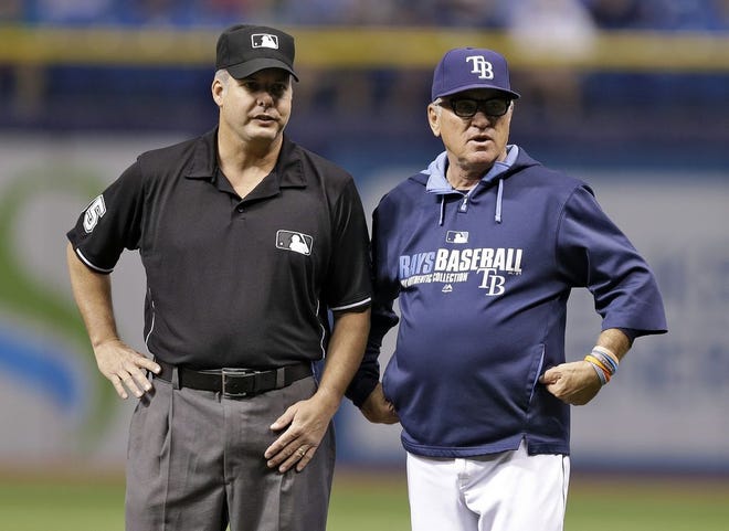 Tampa Bay Rays manager Joe Maddon, right, says his team can make the playoffs even though it has the worst record in baseball.