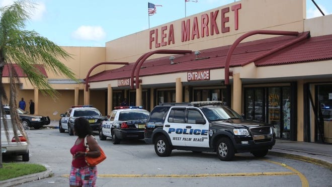 City police investigated a shooting at the 45th Street Flea Market Saturday, September 28, 2013. (Bruce R. Bennett/The Palm Beach Post)