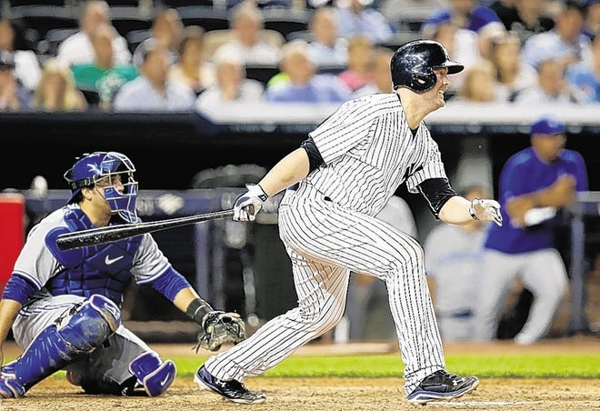 Brian McCann, right, rips a three-run triple in the seventh inning off Jays reliever Brett Cecil on Wednesday night in the Bronx.