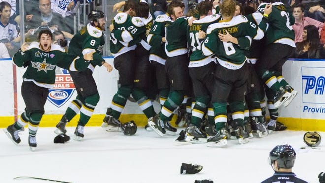 The Texas Stars celebrate their Calder Cup-clinching victory Tuesday night at St. John’s, their first Calder Cup championship.