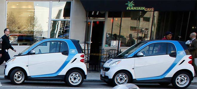 Two Car2Go Smart cars are parked along E. Gay Street Downtown.