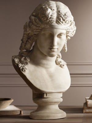 This is a bust of Ariadne cast from plaster and hand rubbed to give it an aged look as an elegant objet d’art from the neoclassical era.