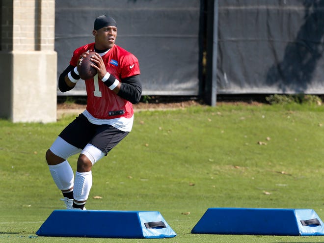 Carolina quarterback Cam Newton drops back to pass during a drill at NFL minicamp in Charlotte, N.C., Thursday.