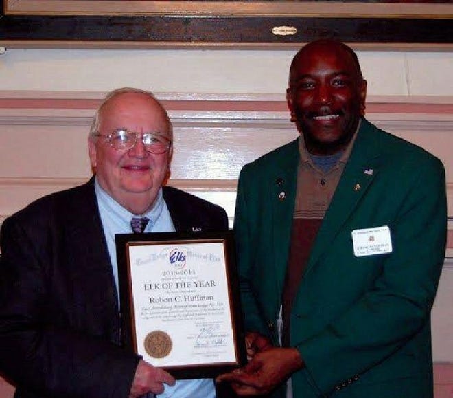 Robert “Bob” Huffman, left, is presented the “Elk of the Year 2013-2014” by the East Stroudsburg Elks Lodge 319 Exalted Ruler Jerome Henderson. He was selected for his many contributions to the lodge and community that includes preparing and serving a meal for the Stroudsburg Methodist Soup Kitchen and working with the Getting Ahead graduates, sending cards and gifts to the military cards, serving to the veterans luncheons and helping the picnic at the Wilkes-Barre V/A hospital and sending cards of cheer to the sick.
