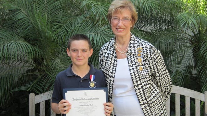 Tommy Null, a fifth-grader at St. Mark’s Episcopal School, recently was awarded the Daughters of the American Revolution Good Citizenship Award. With him is Zee Porter, director with the DAR Seminole Chapter.
