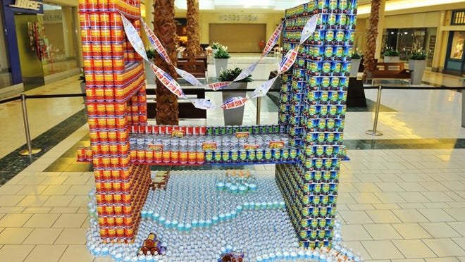 Canstruction 2014 continues through Sunday at The Gardens Mall. This sculpture of the Brooklyn Bridge and the Golden Gate Bridge over USA was created by Palm Beach State College Architecture Department and Architecture Club. TRACEY BENSON PHOTOGRAPHY