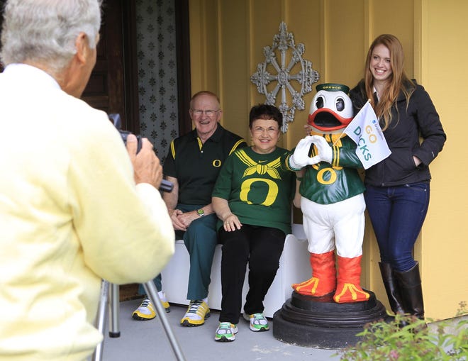 Bob and Pat Brasch (seated) are photographed with UO graduate Alison Brown and the Oregon Duck mascot sculpture she made for their home. On Monday, June 16, 2014 she installed the statue at their front door. Richard Lutchfield snapped pictures. (Paul Carter/The Register-Guard)