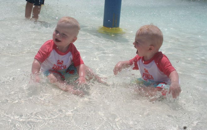 Twin brothers Blake and Logan Crowley, 14 months, of Smithsburg kept cool splashing around in the water at Waynesboro’s Northside Pool on Wednesday.