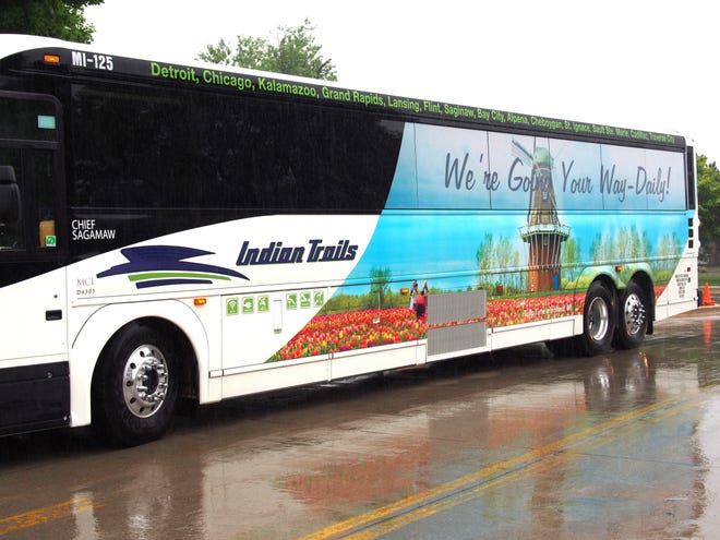 The familiar sights of tulips and DeZwaan Windmill are featured on the sides of an Indian Trails motorcoach that arrived in Holland on Friday afternoon for the first time. Contributed?