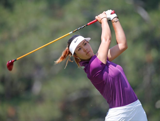 Michelle Wie watches her tee shot on the second hole during the second round of the U.S. Women's Open golf tournament in Pinehurst, N.C., Friday, June 20, 2014. (AP Photo/John Bazemore)