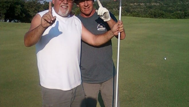 Glen Wertz poses on the left with longtime golf partner Patrick Tucker on the right. Tucker has seen every one of Wertz’s six holes-in-one at Willie Nelson’s golf course.