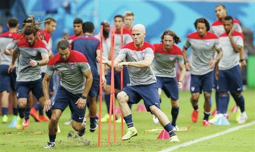 PREPARING — United States’ Michael Bradley, center left, runs through obstacles with teammates during a training session at the Arena da Amazonia in Manaus, Brazil.