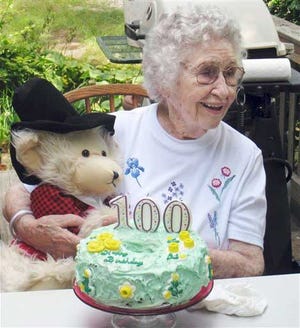 In this Aug. 21, 2009 file photo provided by Scott Barrow, his mother Elizabeth Barrow celebrates her 100th birthday at his home in Dartmouth, Mass. Elizabeth Barrow was found on Sept. 24, 2009, strangled in her Dartmouth nursing home bed with a plastic bag over her head. Laura Lundquist, a 102-year-old woman prosecutors say killed Elizabeth Barrow, still faces a second-degree murder charge. Lundquist is the oldest murder defendant in state history.
