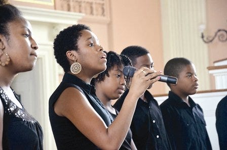 Members of the New Hope Baptist Church youth choir of Portsmouth perform during a Juneteenth celebration at South Church in Portsmouth Saturday afternoon hosted by the Seacoast African American Cultural Center.