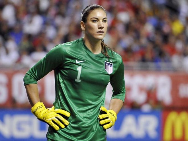 FILE - In this Oct. 20, 2013, file photo, United States goalkeeper Hope Solo pauses on the field during the second half of an international friendly women's soccer match against Australia in San Antonio. Police say Solo has been arrested early Saturday, June 21, 2014, at a suburban Seattle home for assaulting her sister and nephew. (AP Photo/Darren Abate, File)
