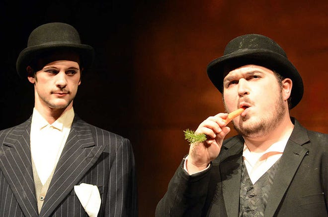 In Washburn University Theatre's production of Samuel Beckett's "Waiting for Godot," Estragon (Colby Cox), right, passes the time eating a carrot as Vladimir (Andrew Fletcher) looks on. The final three performances of the tragicomedy are at 7:30 p.m. Friday and Saturday and 2 p.m. Sunday in the university's Andrew J. and Georgia Neese Gray Theatre.