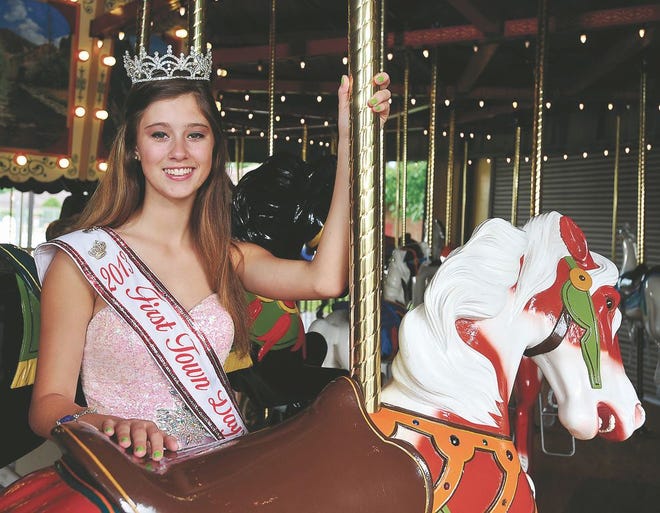 The 2013 First Town Days Queen, Alexis Weyandt, on the Tuscora Park Carousel recently.