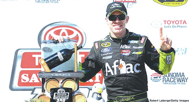 Carl Edwards, driver of the No. 99 Aflac Ford, celebrates in victory lane after winning the NASCAR Sprint Cup Series Toyota/Save Mart 350 at Sonoma Raceway on Sunday in Sonoma, California. (Photo by Robert Laberge/Getty Images)