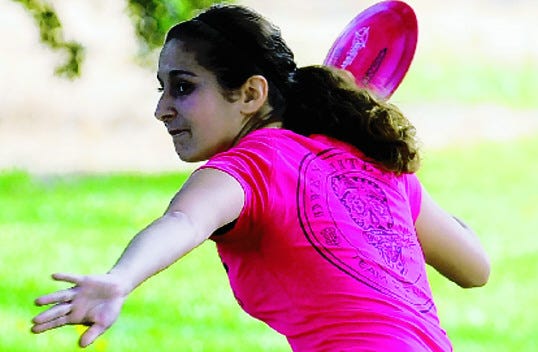 Jessica Weese prepares to release a throw during Saturday's first-round competition in the 20th annual Frying Pan, a B-tier Professional Disc Golf Association-sponsored tournament held Saturday at Oak Grove Regional Park. The final round begins at 9 a.m. today.
