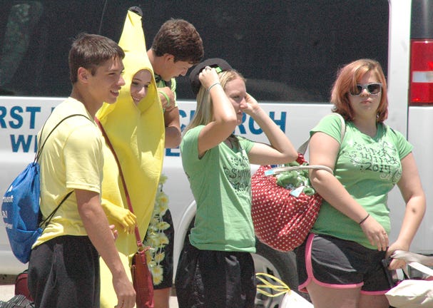 Teens from Groveton First Baptist Church, including one dressed as a banana, arrive at the HPU campus Monday and unpack the van for their home away from home, for Super Summer week.