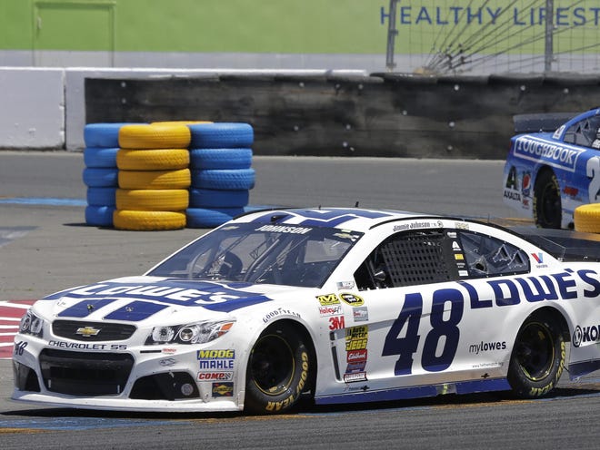 Jimmie Johnson leads Jeff Gordon, right, during Sunday's Cup race in Sonoma, Calif., but Gordon still leads Johnson in the points race.
