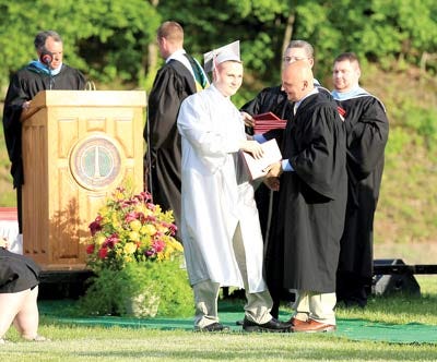 John Derin, High Point Regional High School Class of 2014, receives his diploma from his father, Paul Derin.