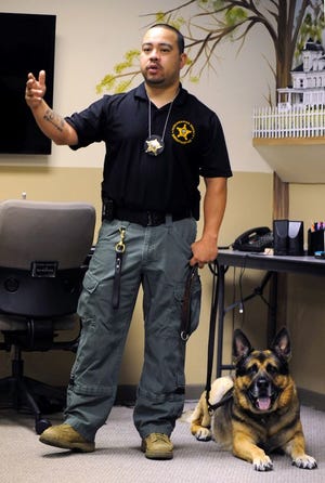 Tuscarawas County Sheriff's Deputy Phil Valdez, with his dog Aron, speaks about meth at the Tuscarawas County Visitors Center in New Philadelphia and about how Aron the dog is instrumental in the fight against drugs.