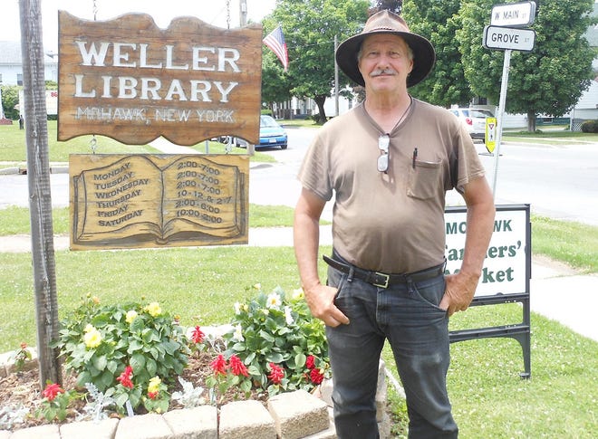 Steve Young of Patrick Springs, Va., stands outside of Weller Library during their centennial celebration on Saturday. Young stopped in Mohawk for the weekend as part of his journey to raise money for the Victory Junction Gang Camp, which helps seriously ill children. TELEGRAM PHOTO/STEPHANIE SORRELL-WHITE