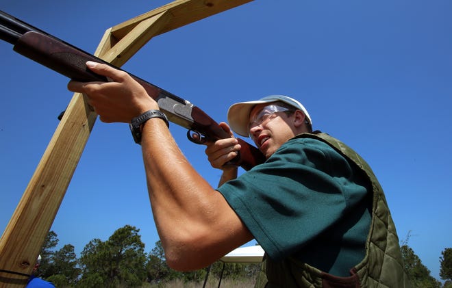 Erik Prinz, recreation coordinator, takes aim at a flying target at the sporting clays facility at Streamsong in April.